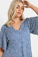 Büyük Beden V Yaka Kısa Kollu Eteği Bollaşan Desenli Bluz 303624